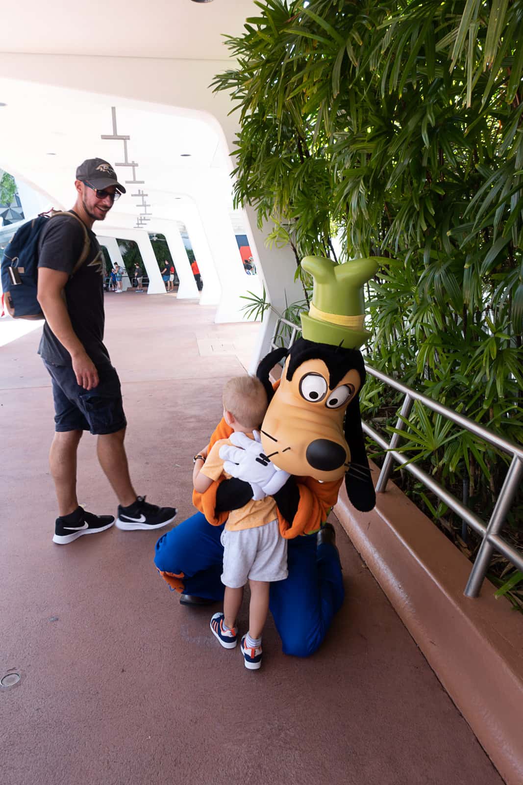 Meeting a Disney World character where the entrance to Epcot is