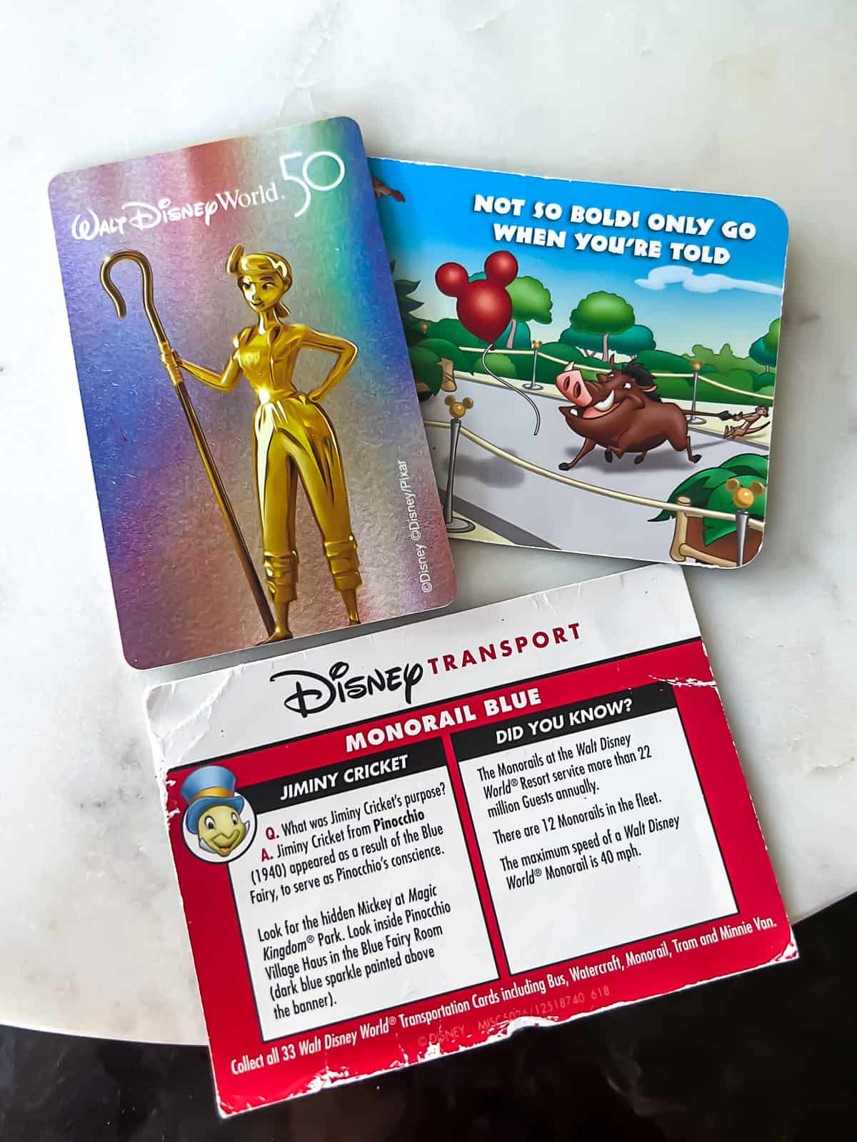 Collection of Disney World tickets and cards including Bo Peep and Disney Transport pass