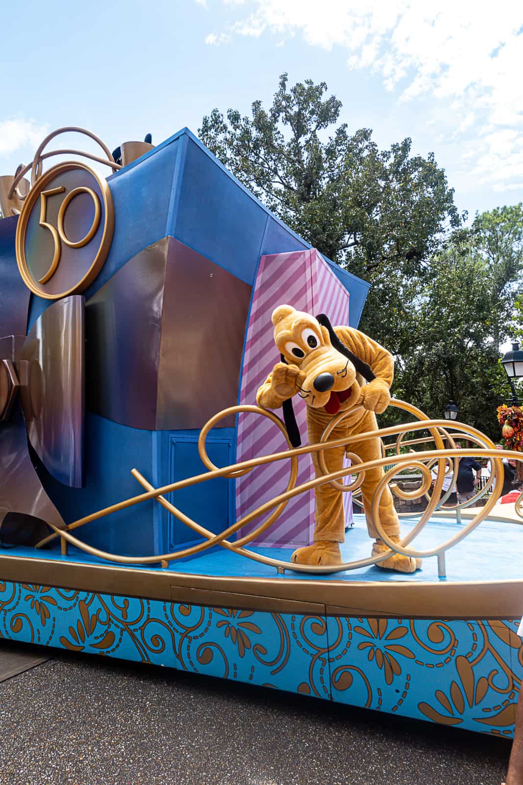 Disney World Parade Photo With Pluto at Magic Kingdom