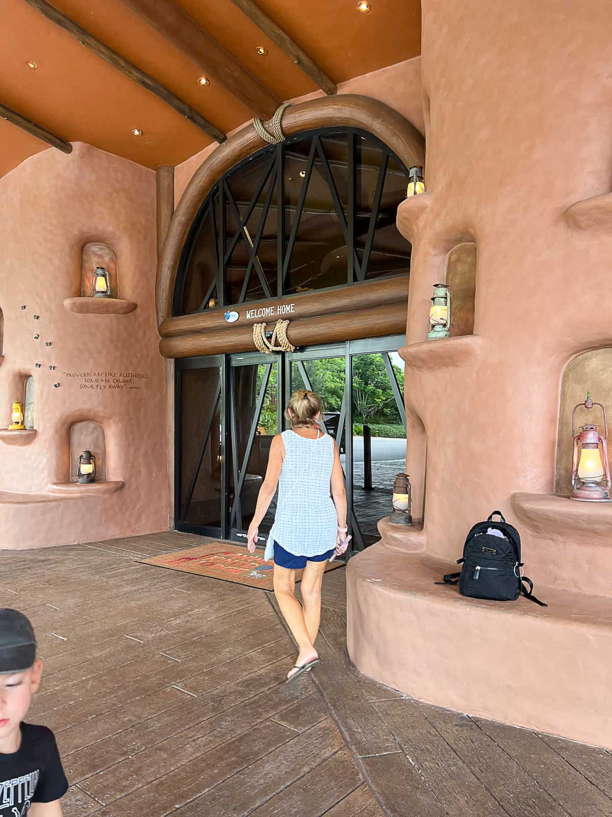 Disney World Tourist walking inside the Animal Kingdom Lodge Resort