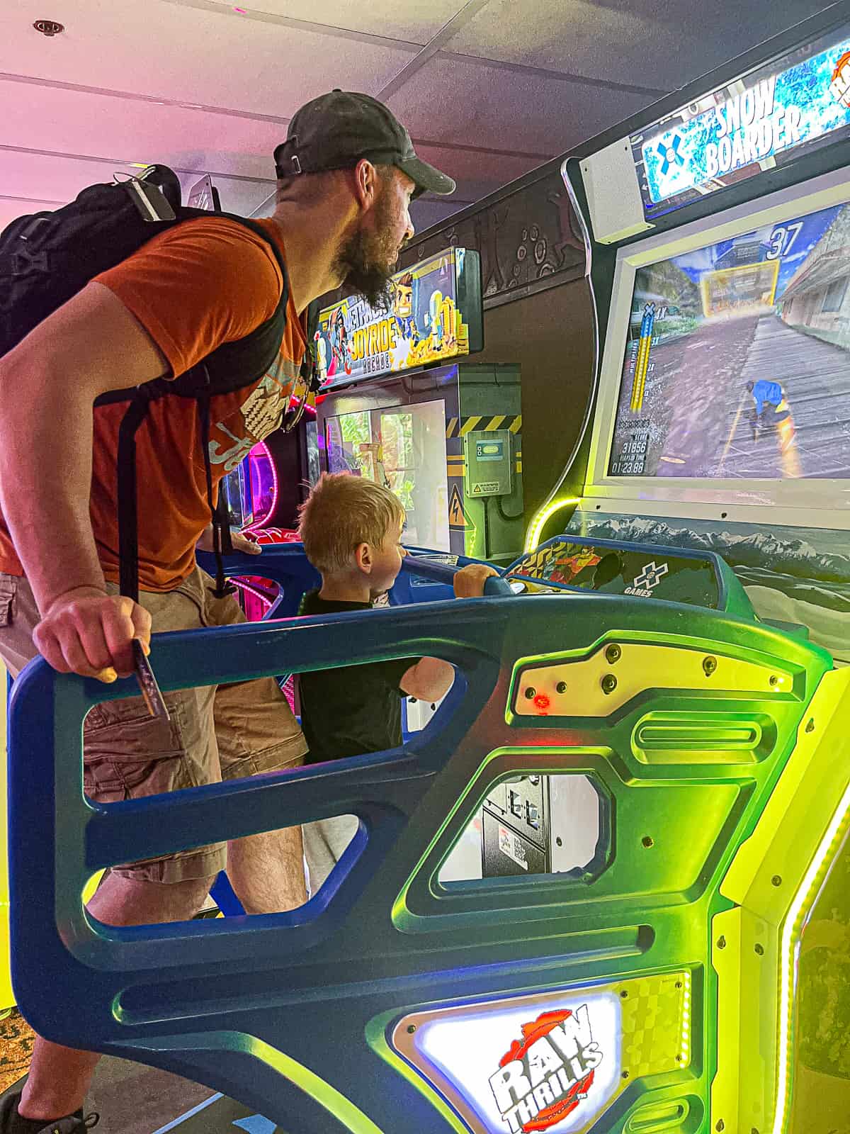 Disney World Travel Blogger Playing at Pumbaa's Fun and Games Arcade at Animal Kingdom Lodge Resort in Disney World