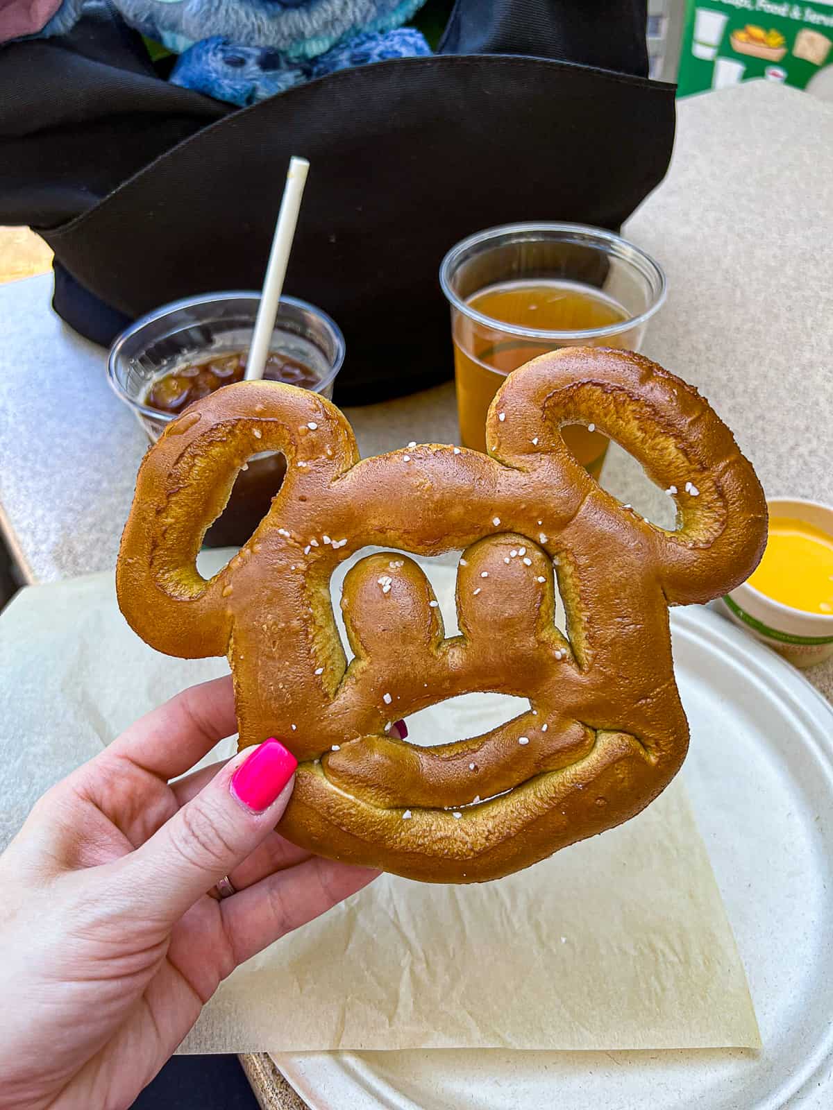 Holding a Mickey Mouse Pretzel from Disney World Resort