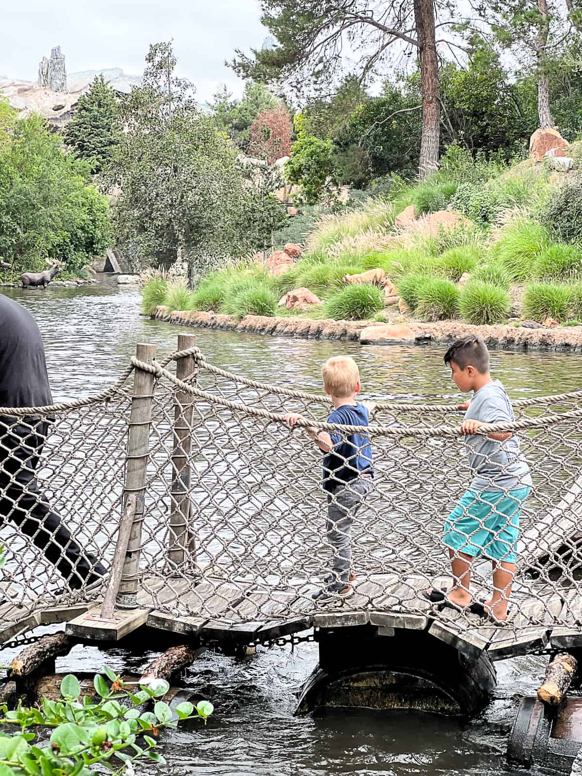 Visitors on a bridge at Pirate's Lair on Tom Sawyer Island at Disneyland